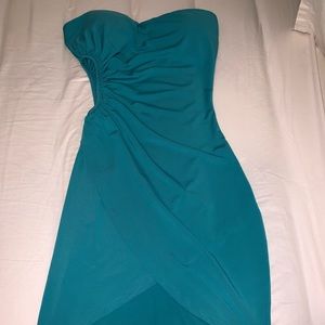 Turquoise dress with open side.